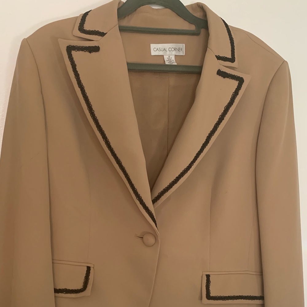 Beige blazer with black trim